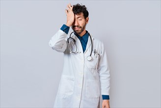 Tired doctor with hand on forehead