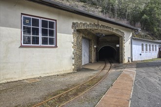 Miners' transportation railway leading to mine gallery