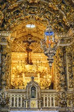Old and luxurious gold-plated baroque altar in a historic church in the city of Salvador in Bahia