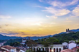 View of old houses and churches in colonial architecture from the 18th century at sunset in the historic city of Ouro Preto in Minas Gerais