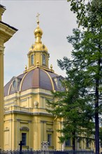 Orthodox Christian church with golden cupolas inside the gardens of Saint Peter's fortress in Saint Petersburg