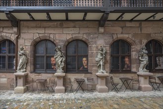 Historic courtyard with sculptures of the four seasons