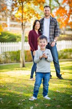 Outdoor portrait of multiethnic chinese and caucasian family