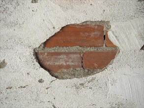 Peeled plaster detached from a wall