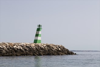 Marker on a groyne at the harbour entrance in the port of Lagos