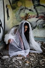 Deranged bride in abandoned place. Inspired by the traditional American legend of la llorona