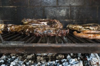 Grilled meat in the barbecue grill. Argentinian grill style
