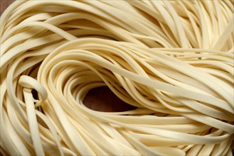 Uncooked ribbon noodles