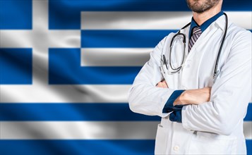 Doctor arms crossed with stethoscope over greece flag. Health and care with flag of greece