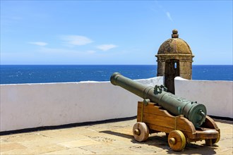 Old historic fort and colonial guardhouse with cannon pointed to the sea in the city of Salvador in Bahia