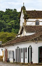 Houses and church with the forest in the background in the historic city of Paraty in Rio de Janeiro