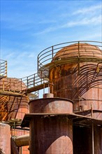 Old machinery tanks and infrastructure of an iron ore handling industry in the state of Minas Gerais