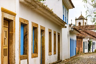 Old houses facades in colonial architecture and cobblestone streets in the historic city of Paraty on the south coast of Rio de Janeiro
