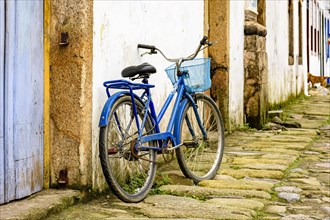 Bike in the old cobblestone streets of the city of Paraty with its historic colonial-style houses.