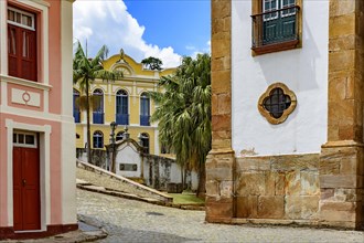 Old cobblestone street with houses in colonial architecture in the famous city of Ouro Preto in Minas Gerais