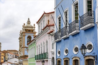 Facades of old colorful colonial style houses and churches in the historic district of Pelourinho in the city of Salvador in Bahia