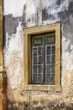 Window on the side of an old church in colonial architecture in the historic city of Ouro Preto in Minas Gerais