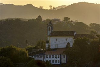 Sunset in the historic city of Ouro Preto in Minas Gerais with its churches and mountains