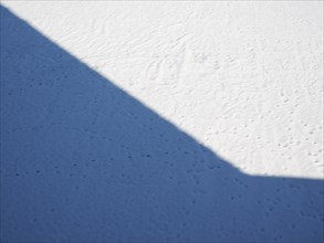Shadow over white snow background