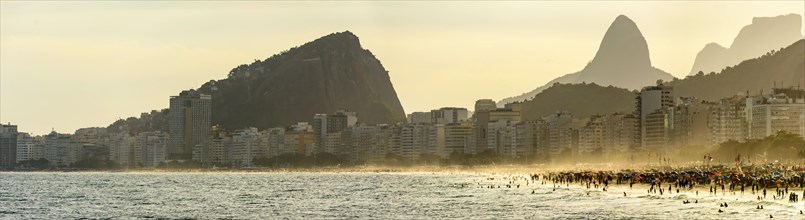 Panoramic image of Copacabana beach during sunset on a tropical summer afternoon in the city of Rio de Janeiro
