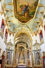 Ceiling and altar of the church of Sao Pedro dos Clerigos created in the 18th century with its neoclassical style interior painted in gold in the Pelourinho neighborhood of Salvador