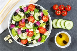 Greek salad with fresh tomatoes olives and feta cheese healthy eating food from above on slate in Stuttgart