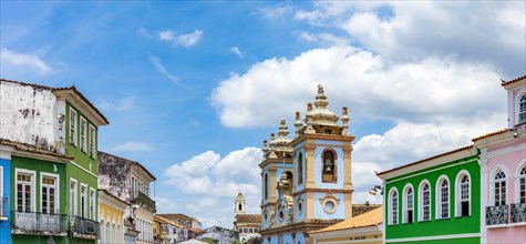 Colorful facades of houses and historic church in Pelourinho in Salvador on a sunny day