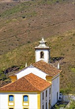 View from behind of old and historic church in colonial architecture from the 18th century in the city of Ouro Preto in Minas Gerais