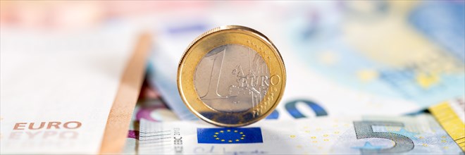 One euro coin save money finance pay pay panorama with text free space in Stuttgart