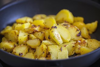 Delicious fried potatoes braise in a pan