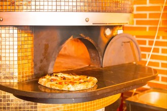 Artisan pizza oven. Pizza fresh out of the oven