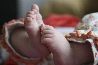 Close-up of two baby feet of a newborn child