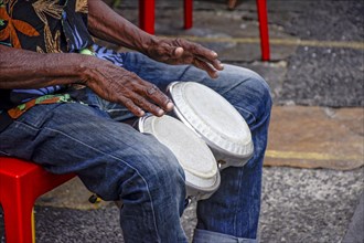 Percussionist playing bongo in the streets of historic Pelourinho district in Salvador
