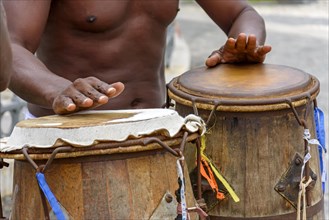 Musician playing atabaque which is a percussion instrument of African origin used in samba