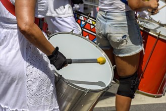 Drums and drummers playing samba during carnival celebrations in the streets of Brazil