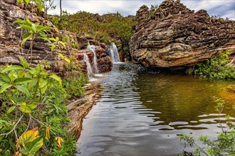 Beautiful river and waterfalls among the preserved vegetation of the Biribiri environmental reserve in Diamantina