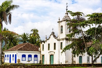 Famous churche between th vegetation in the ancient and historic city of Paraty on the south coast of the state of Rio de Janeiro founded in the 17th century