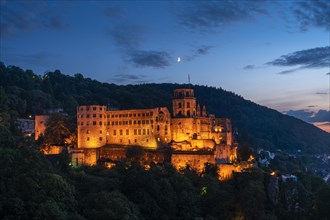 The illuminated castle of the city of Heidelberg at blue hour