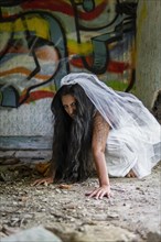 Deranged bride in abandoned place. Inspired by the traditional American legend of la llorona