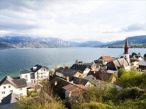 View over the village Attersee am Attersee and the evangnlical church to the lake Attersee