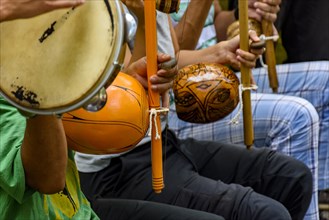 Afro Brazilian percussion musical instruments during a capoeira performance in the streets of Brazil