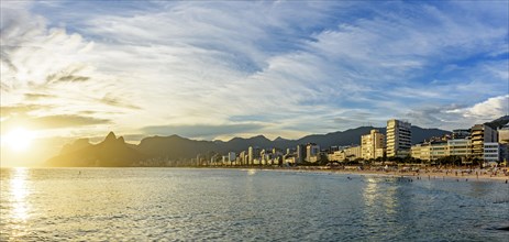 Panoramic image of Ipanema beach during sunset with the sea