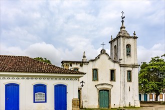 Historic church facade and colonial style house in the famous city of Paraty on the coast of Rio de Janeiro
