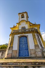 Historic church with its stairs and tower in the city of Ouro Preto in Minas Gerais seen from below
