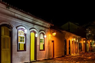 Stone street and colonial style houses illuminate at night in the city of Paraty on the coast of Rio de Janeiro