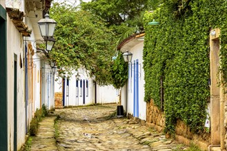 Streets of cobblestone and old historical houses in colonial style on the streets of the old and historic city of Paraty founded in the 17th century on the coast of the state of Rio de Janeiro