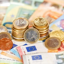 Euro coins and banknotes save money finance pay pay banknotes square in Stuttgart
