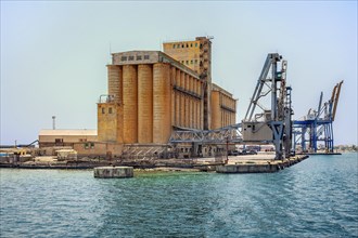 Grain silo and cranes in the port of Port Sudan