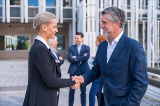 Handshake of Successful Business Executives in a Downtown Area