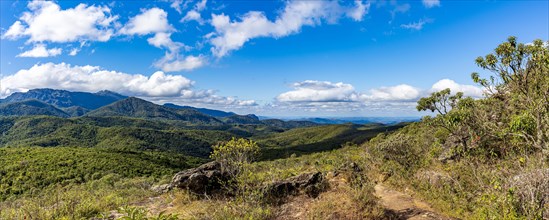 Panoramic image of the mountain ranges with their rocks and vegetation and typical forests of the state of Minas Gerais in Brazil on a sunny day